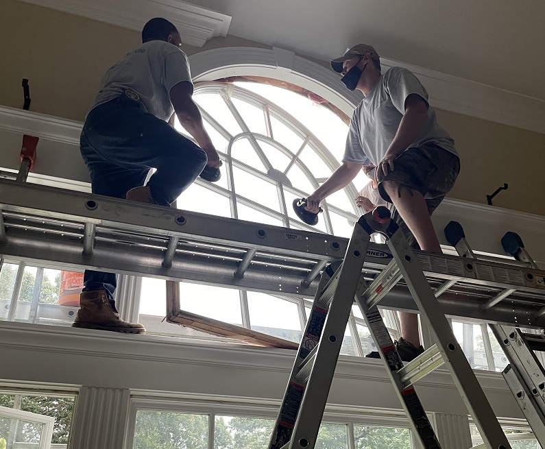 Suction cups are used to remove the old custom windows 